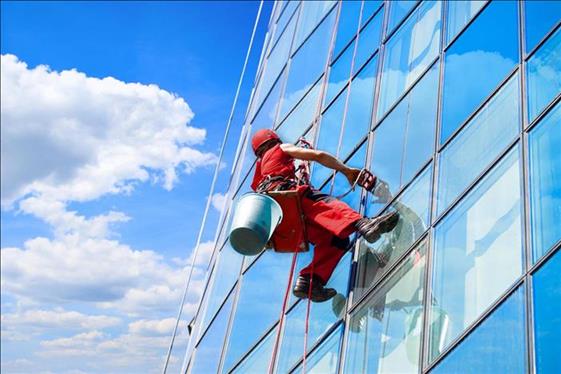 cleaning windows of high-rise building