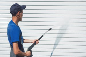 cleaning walls using pressure washer